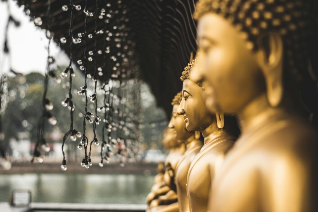 Buddha statues at Seema Malakaya overlooking Beira Lake in Colombo, Sri Lanka.